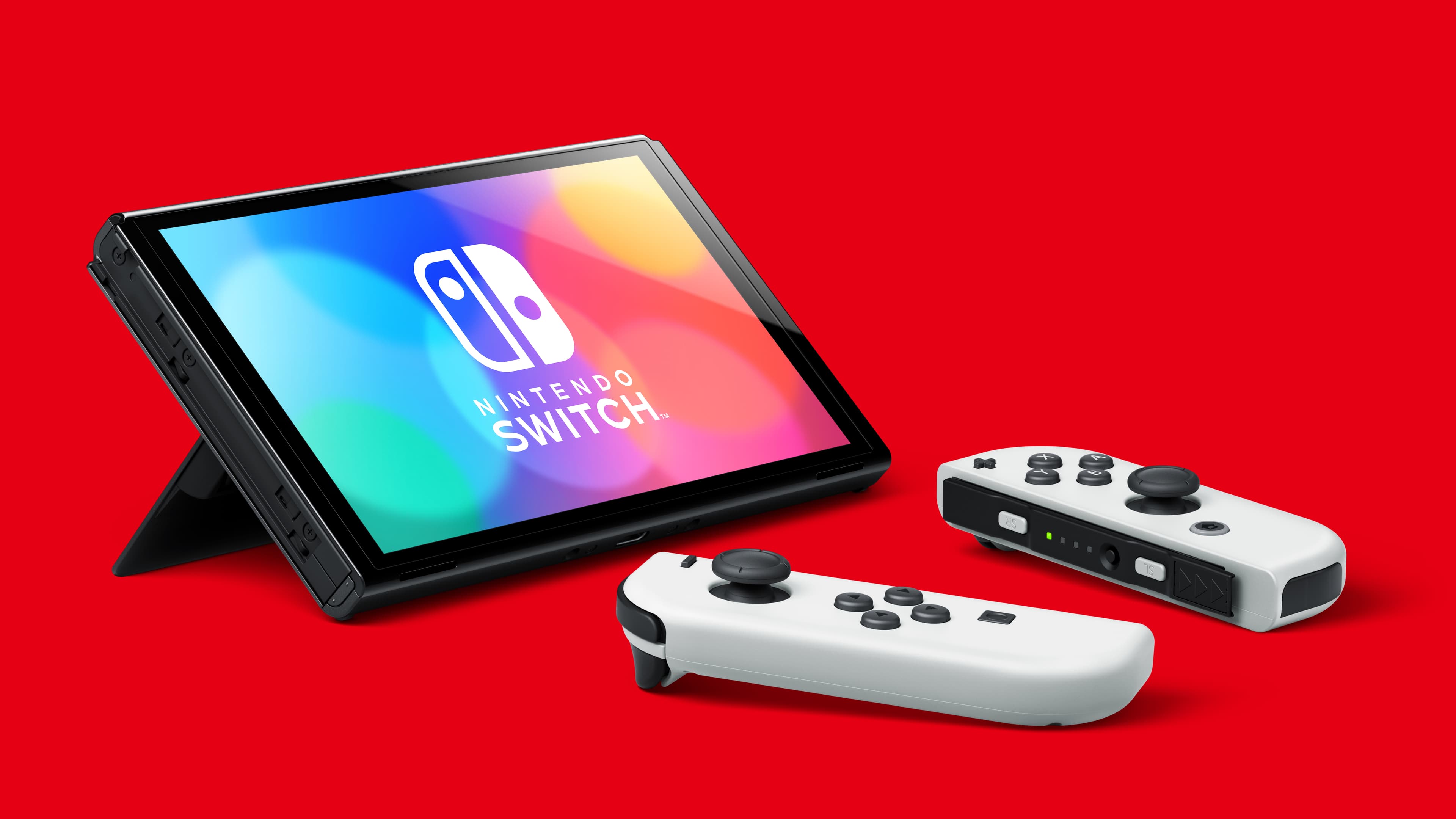 Imagen de catálogo de Nintendo Switch OLED con Joy-Con blancos. Comprueba el contenido del paquete en la tienda.
